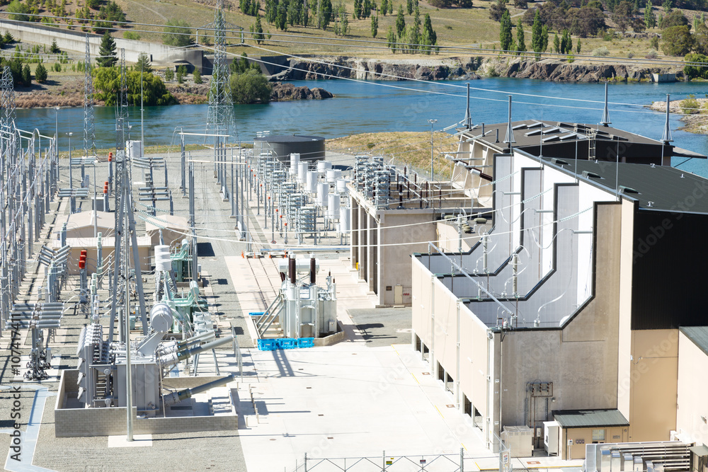 power transmission station near lake in summer day in new zealan