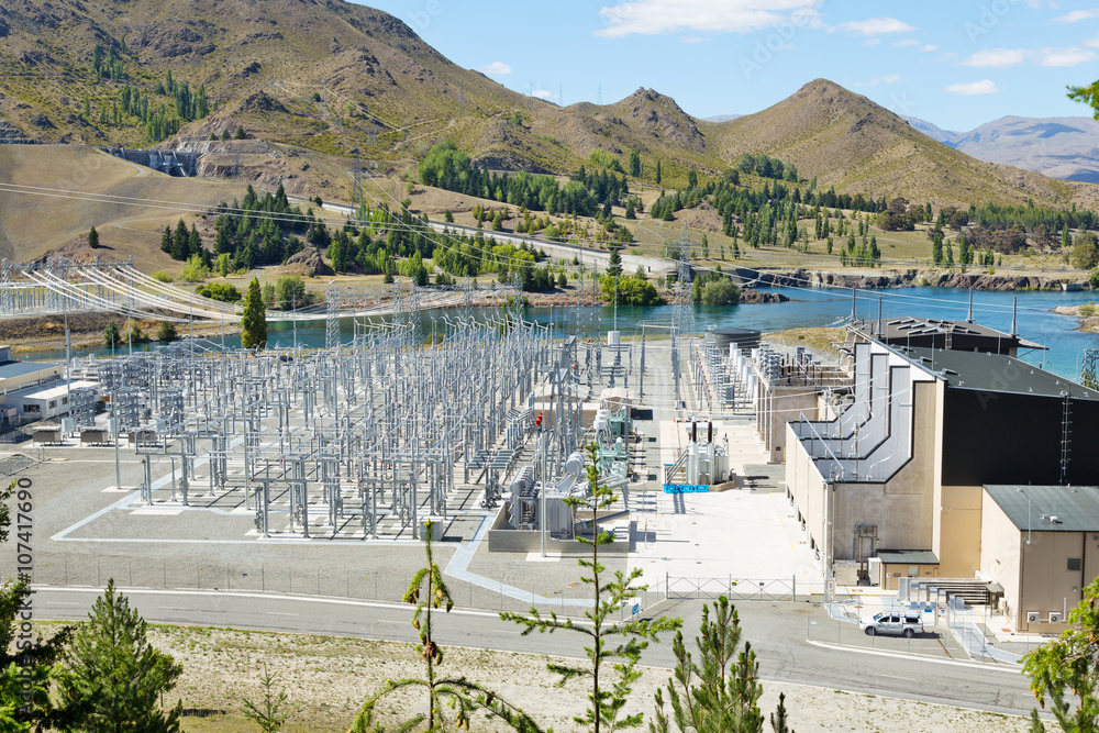 power transmission station near lake in summer day in new zealan