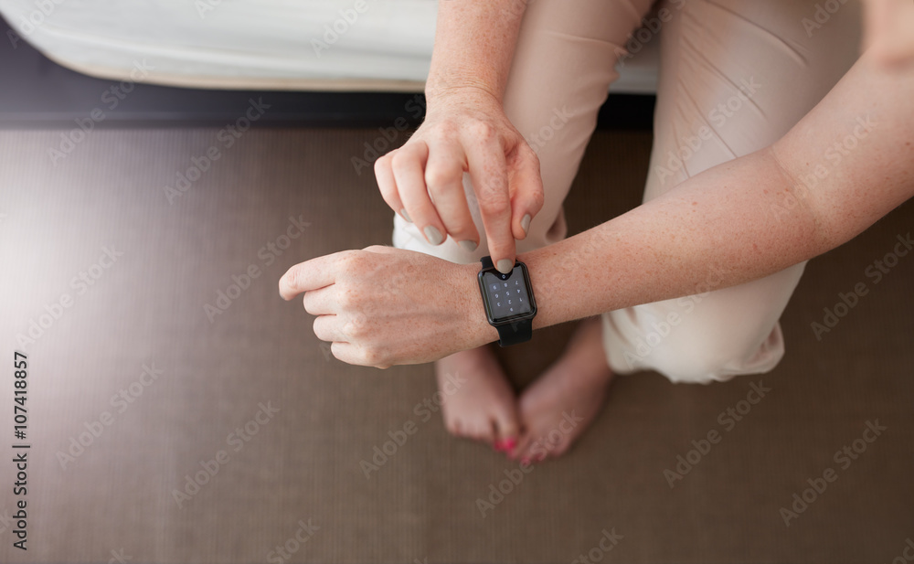 Female hands using smartwatch