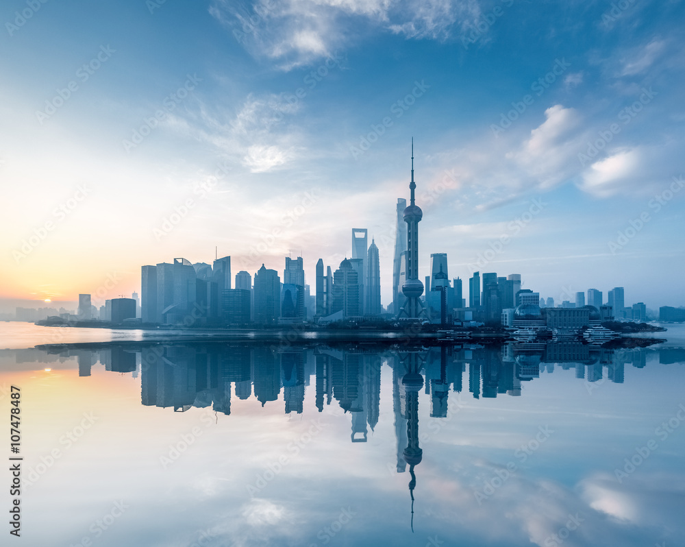 shanghai skyline with reflection in sunrise