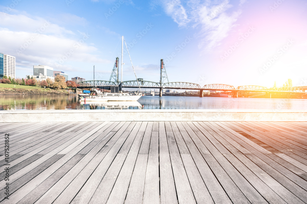 yacht on sea and bridge on water in blue sky