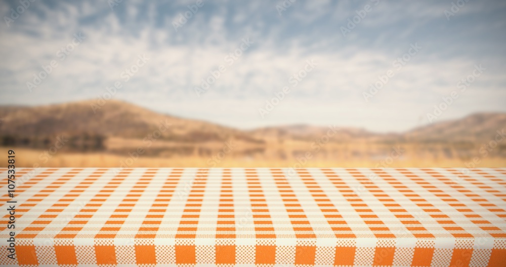 Composite image of orange and white tablecloth