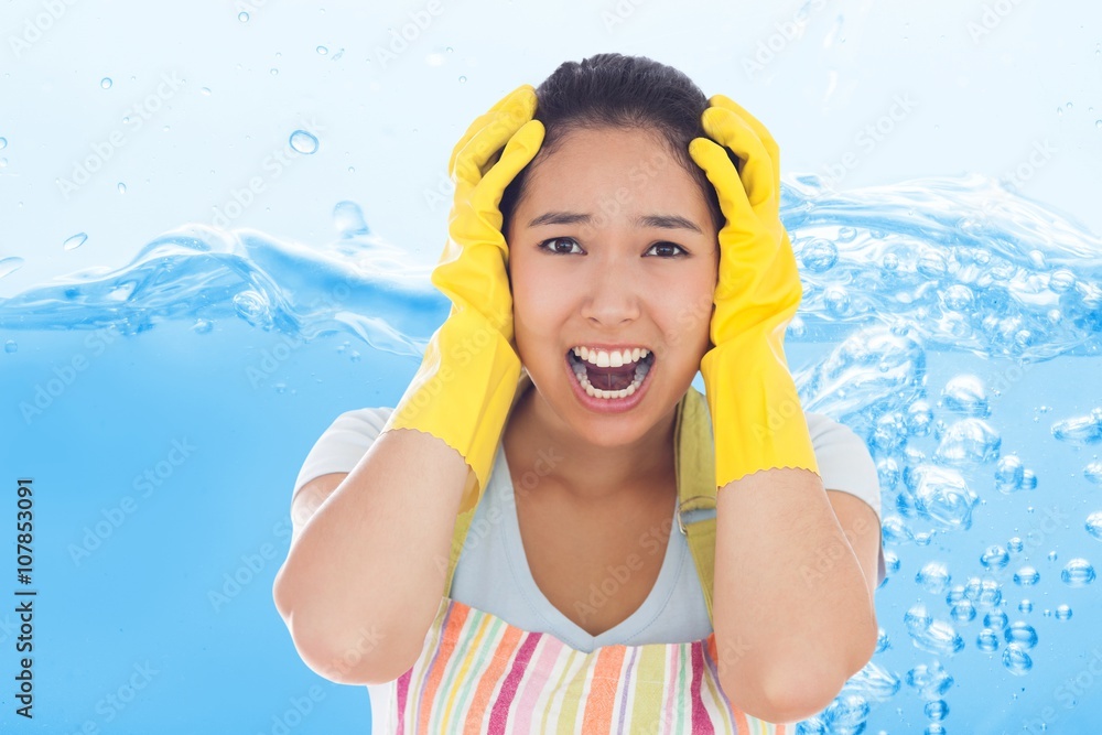 Composite image of distressed woman wearing apron