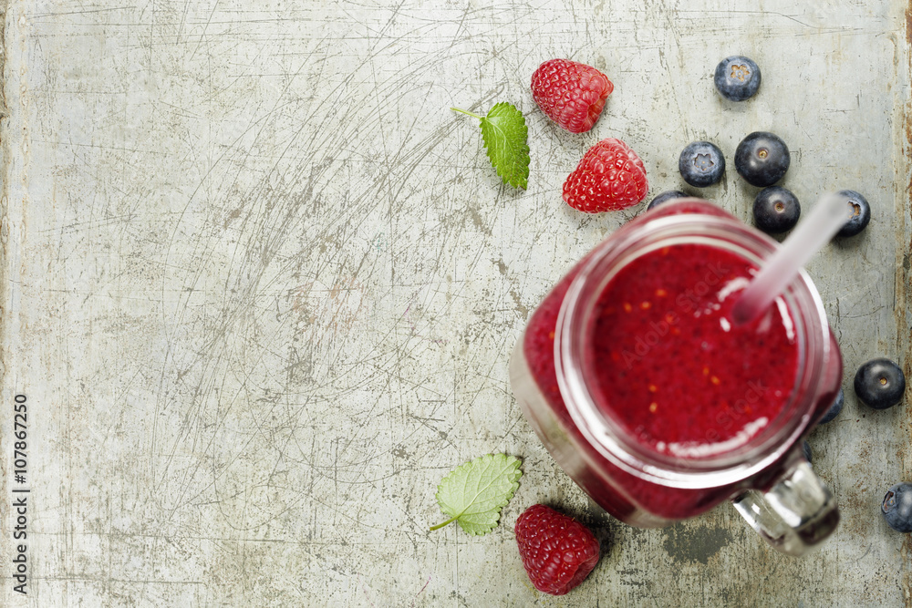 Berry smoothie on rustic background