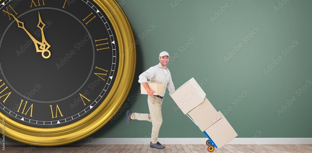 Composite image of happy delivery man with trolley