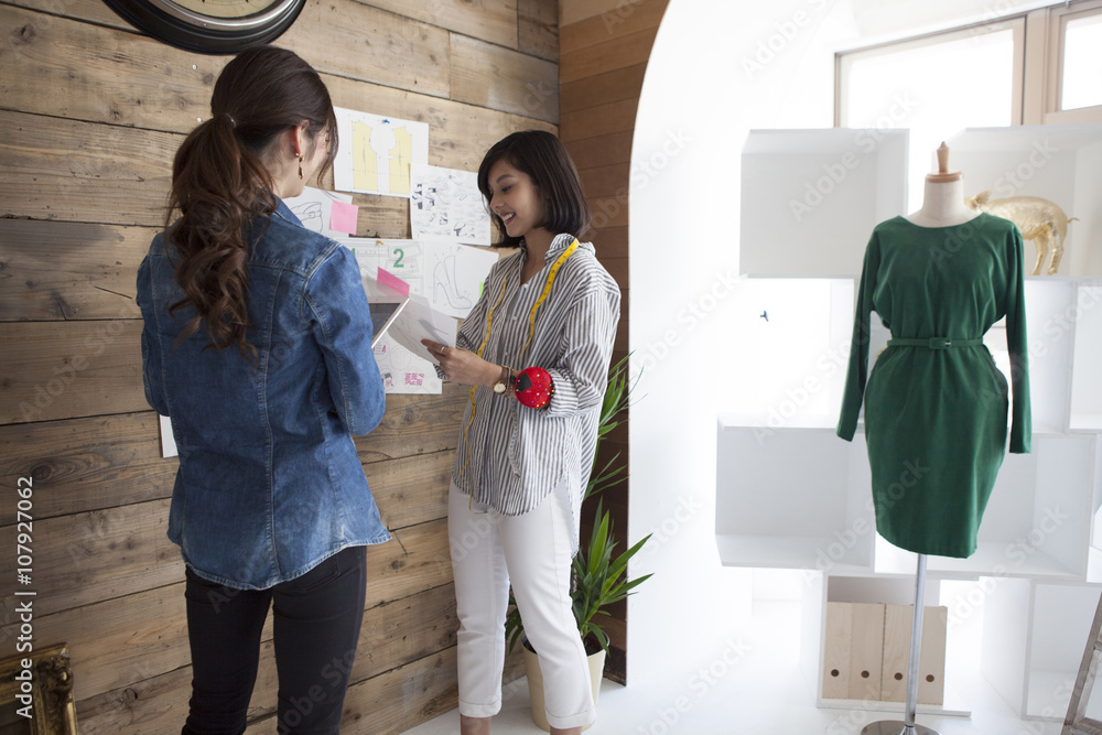 Two women are thinking about the design of the shoes