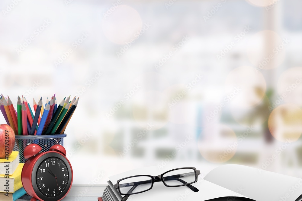 Composite image of school supplies on desk