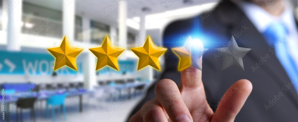 Businessman rating stars with his hand