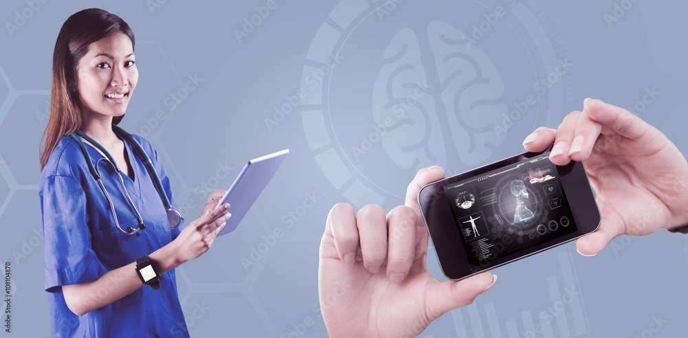 Composite image of asian nurse using tablet