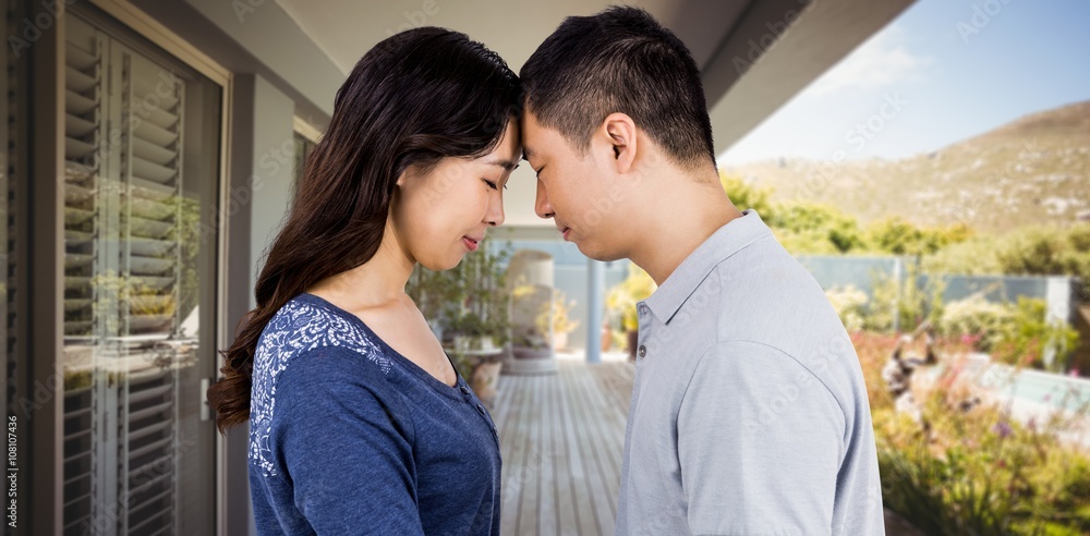 Composite image of loving couple head to head