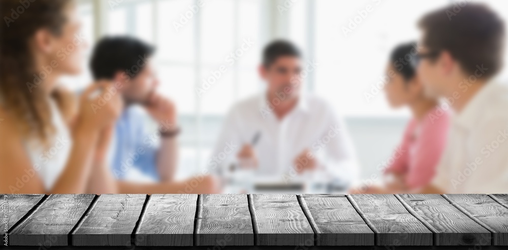 Composite image of wooden desk