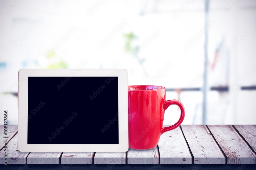 Composite image of laptop on a table