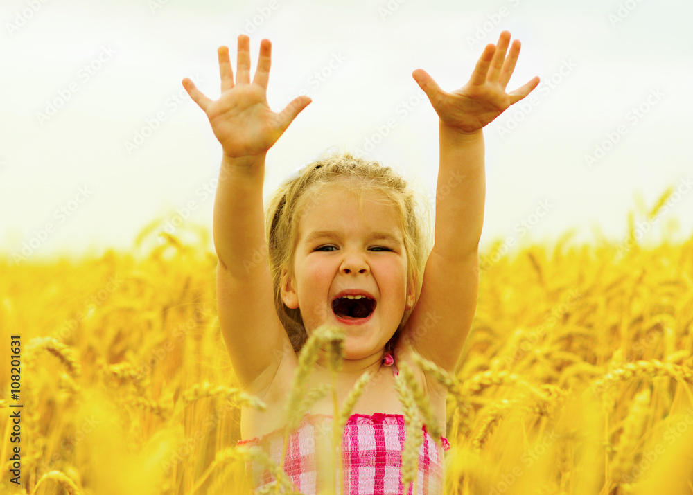 Girl on a wheat