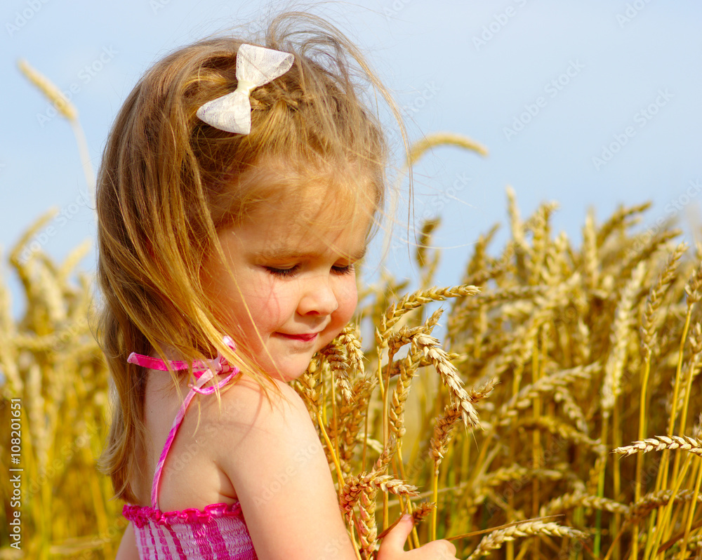 Girl on a wheat