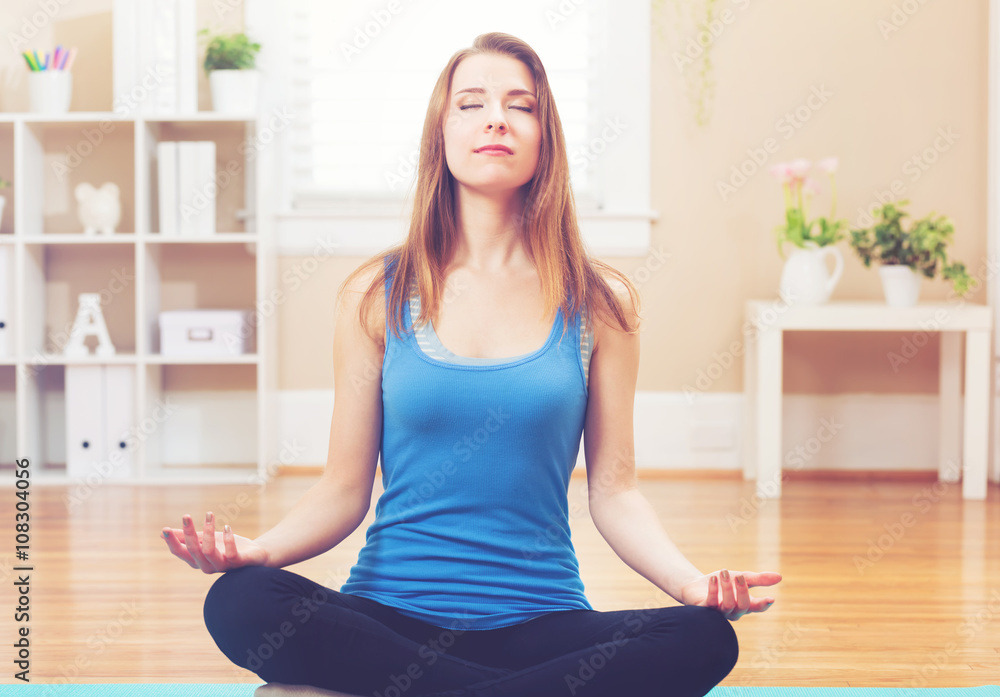 Young woman practicing meditation