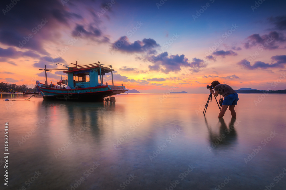 Long boat with beautiful sunrise seascape, beach in Phuket, Thailand