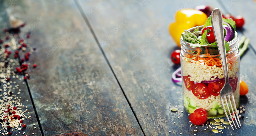 Cucumber, quinoa, tomato, onion, carrot and mint salad in a jar