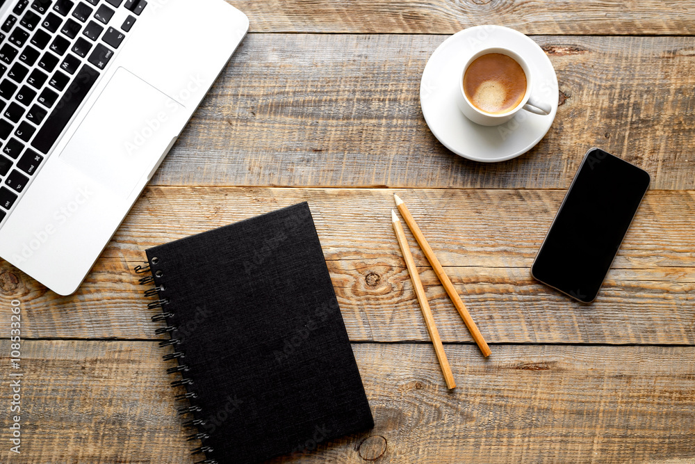 Working place with laptop on wooden table