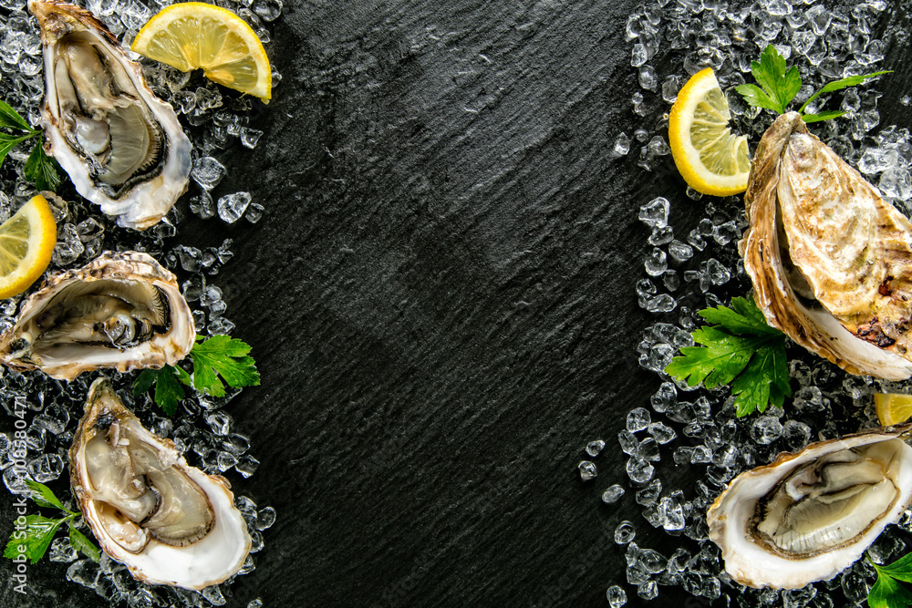 Oysters served on stone plate with ice drift