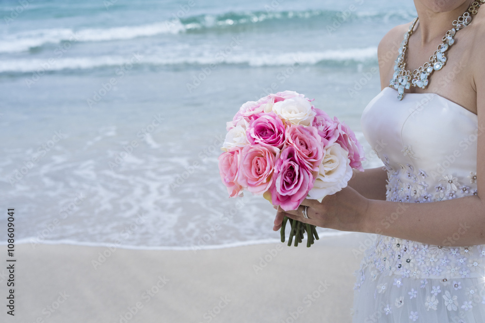 Bridere shooting the wedding photos on the beach