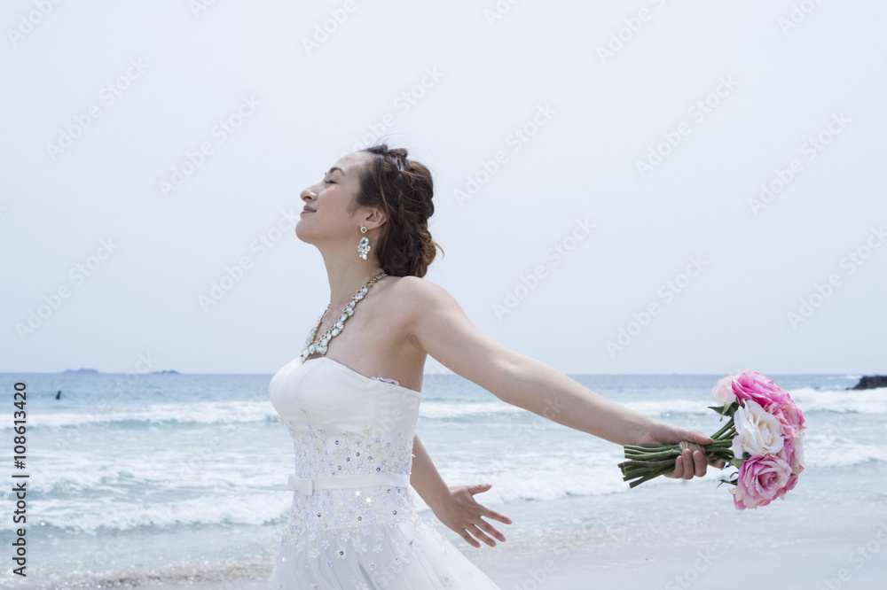 Bridere shooting the wedding photos on the beach