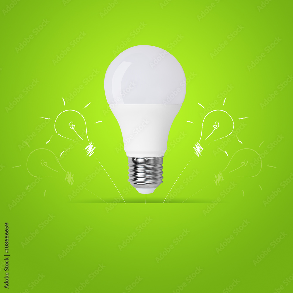 led bulb on green background