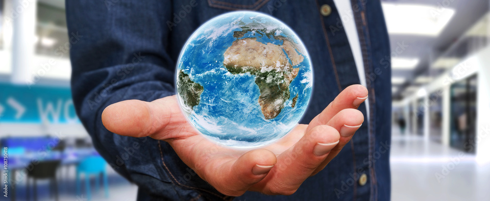 Man holding the planet earth in his hand