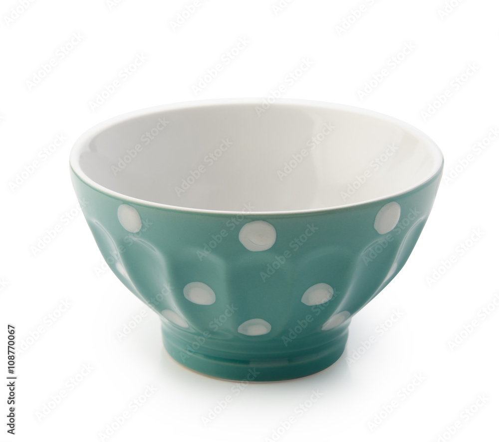 Blue bowl with white polka dots. Isolated with clipping path.