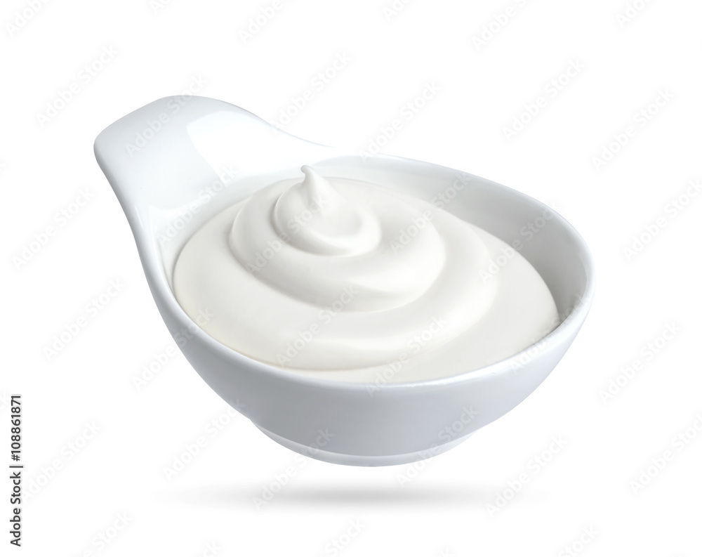 Mayonnaise in bowl isolated on white background with clipping path. Sour cream isolated.