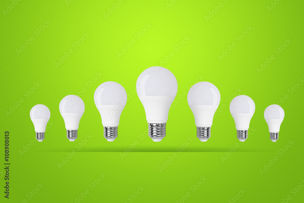 led bulb on green background