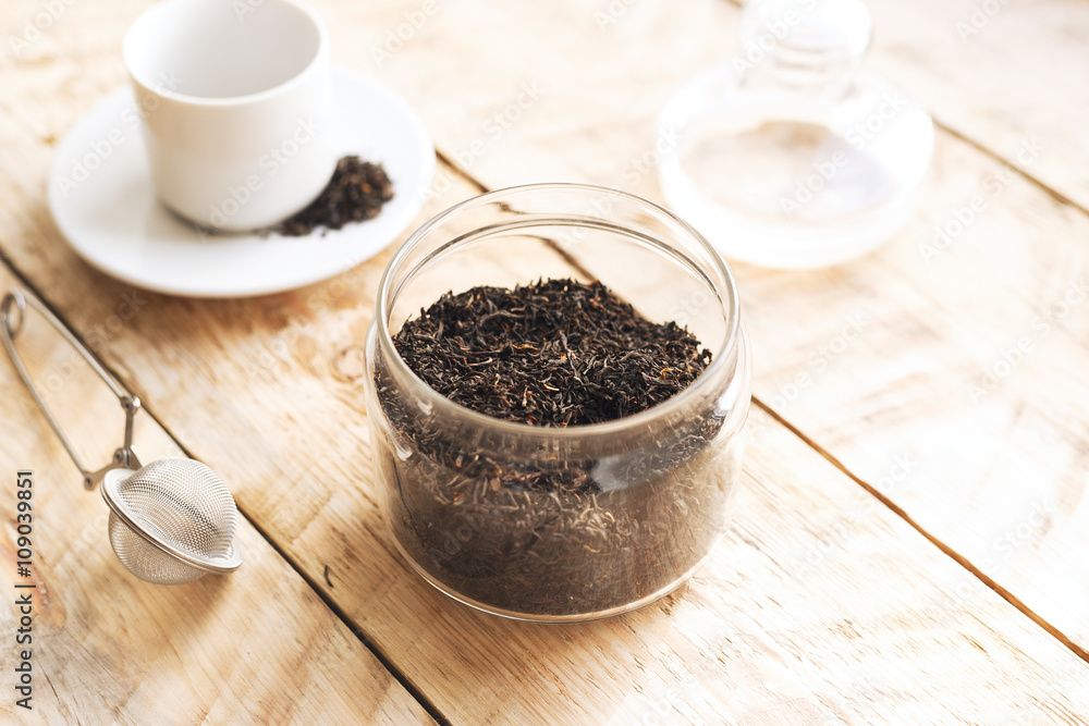 Tea set on the wooden table at sunny morning