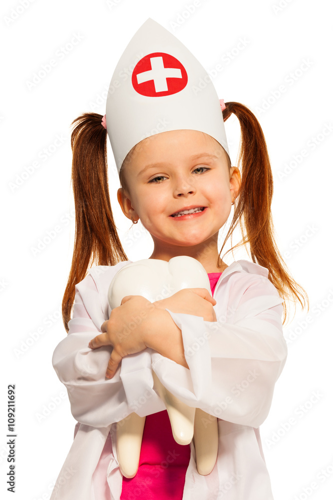 Smiling girl with pigtails dressed as a dentist