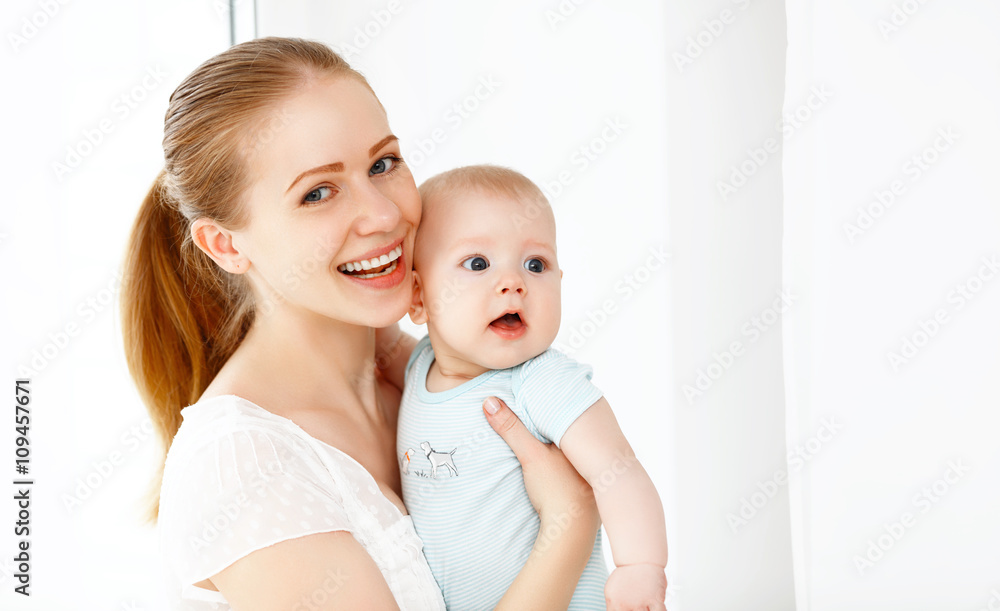 happy family mother playing  with baby