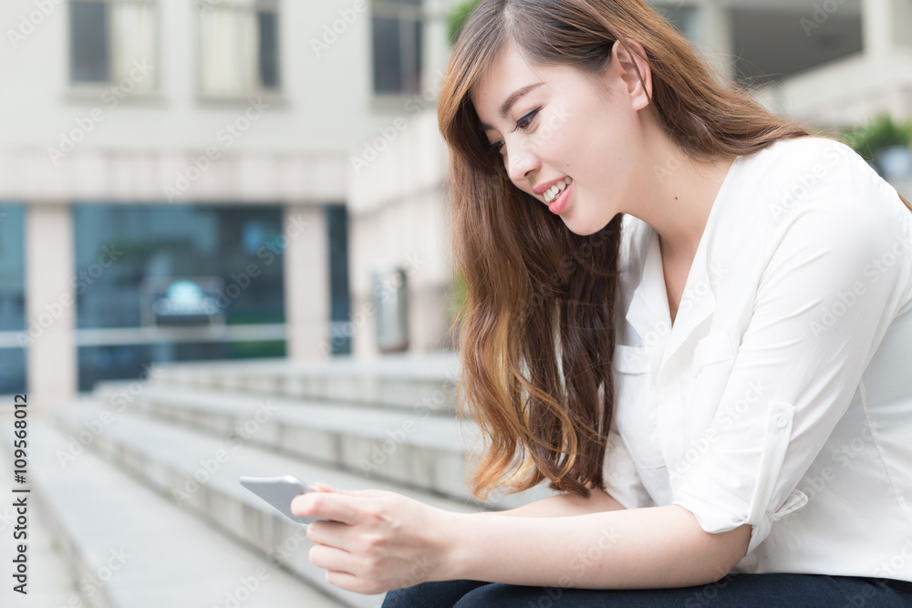 young beautiful asian girl with tablet in school