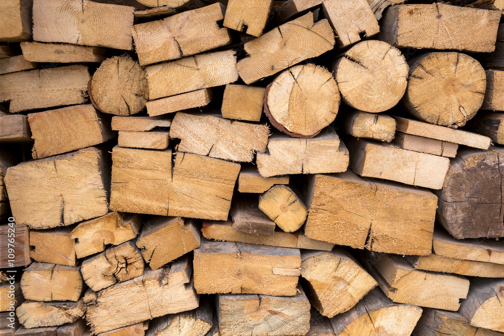 Abstract photo of a pile of natural wooden logs.jpg