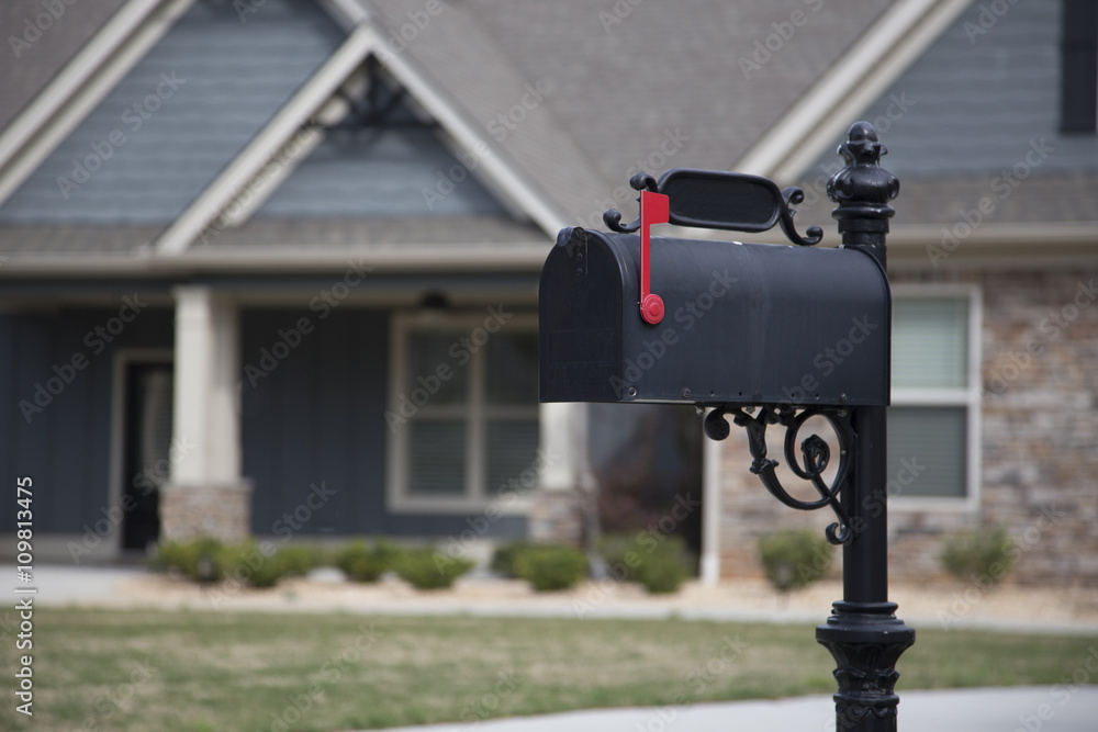 Black Mail Box in Front of a House