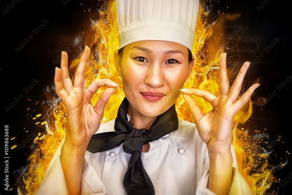 Composite image of closeup of a smiling female cook gesturing ok