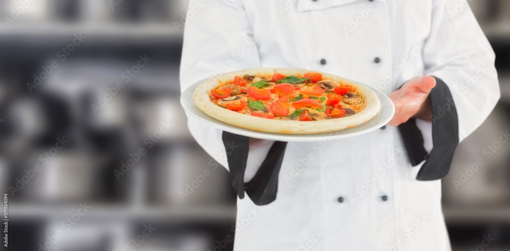 Composite image of close up on a chef presenting a pizza