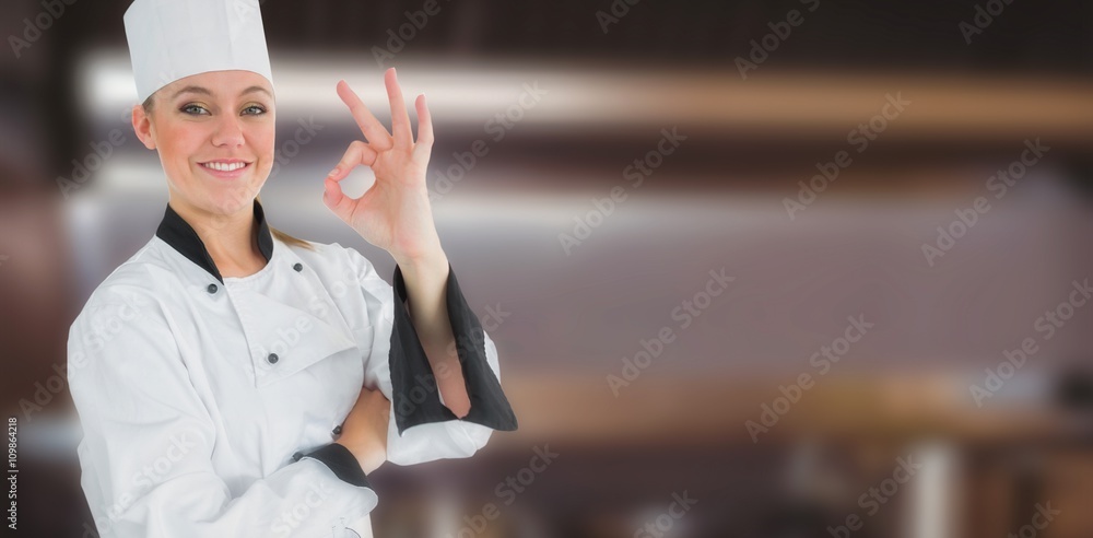 Composite image of happy female chef gesturing ok sign 