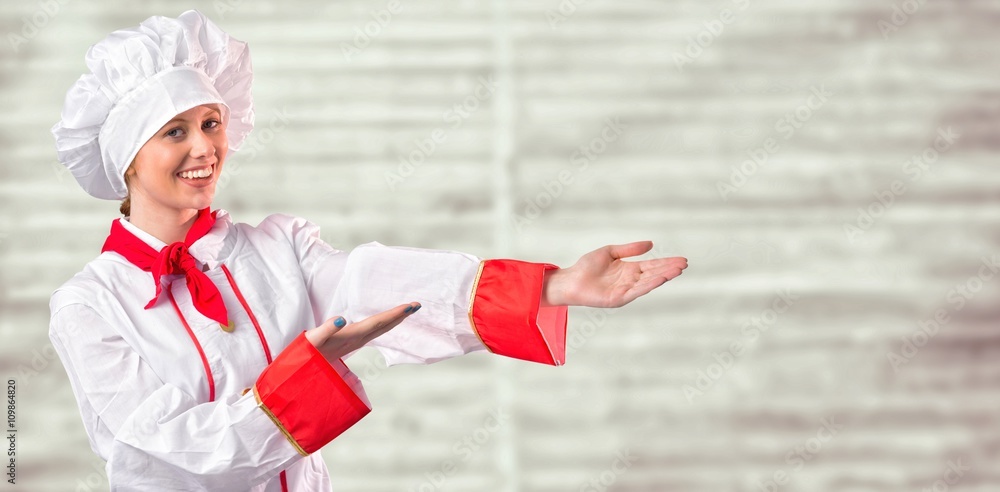 Composite image of pretty chef presenting with hands