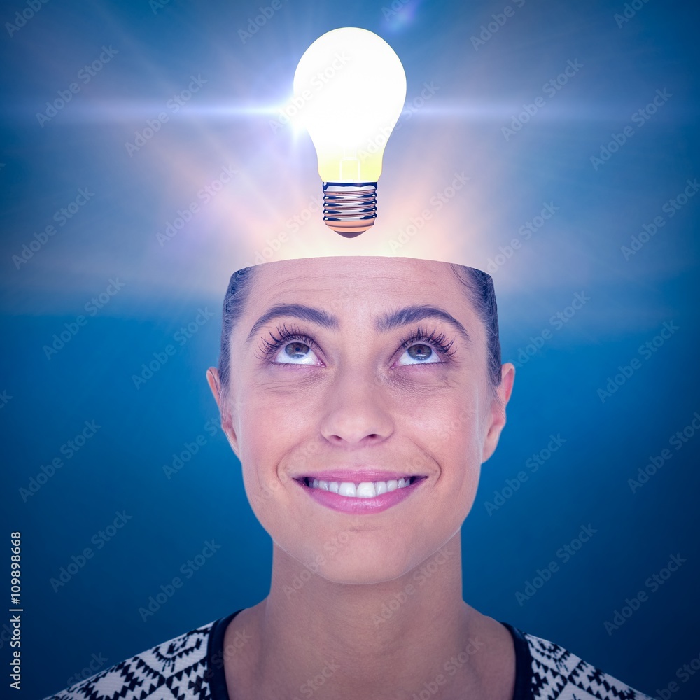 Composite image of beautiful woman looking up over white backgro