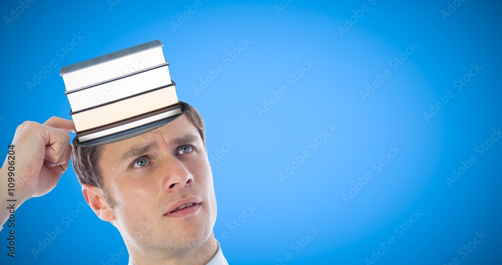 Composite image of thinking businessman scratching head