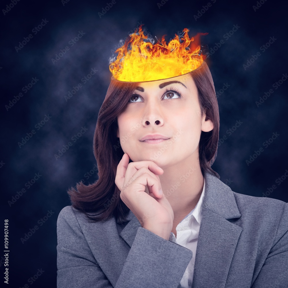 Composite image of focused businesswoman