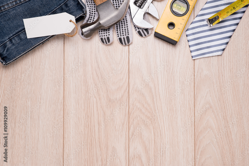 Happy Fathers Day with tools on a rustic wooden background