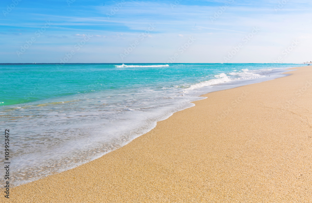 Waves lap the shore on the beach