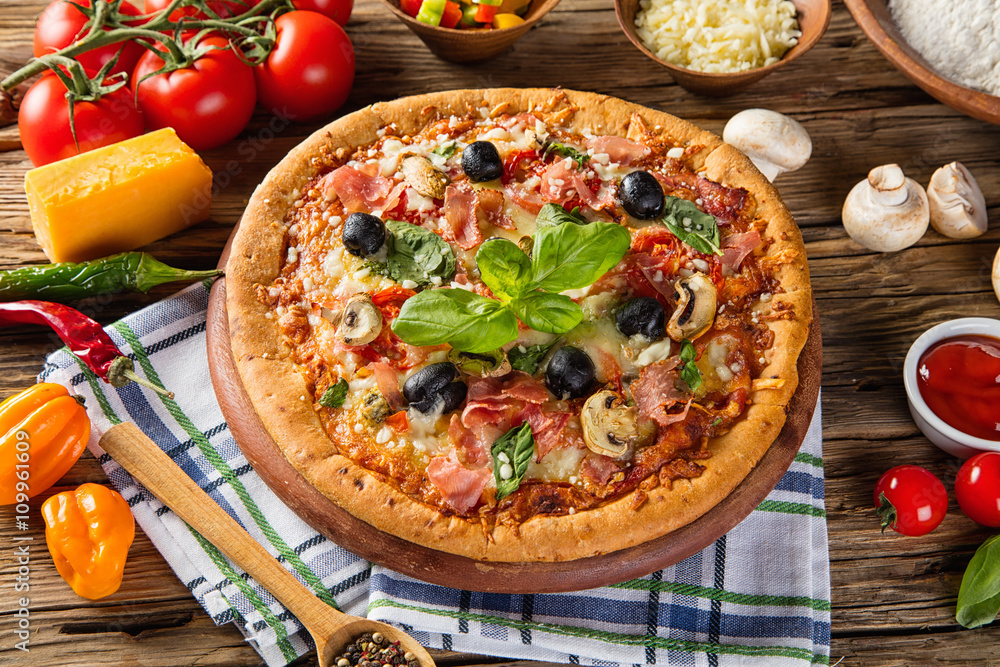 Rustic pizza with ingredients, top view