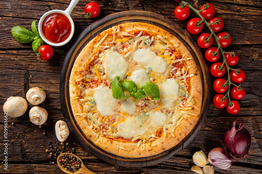 Rustic pizza with ingredients, top view