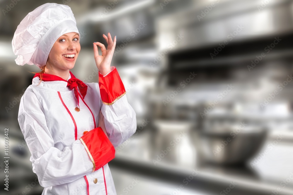 Composite image of pretty chef standing with arms crossed