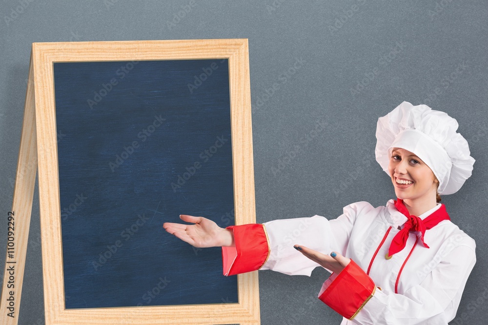 Composite image of pretty chef presenting with hands