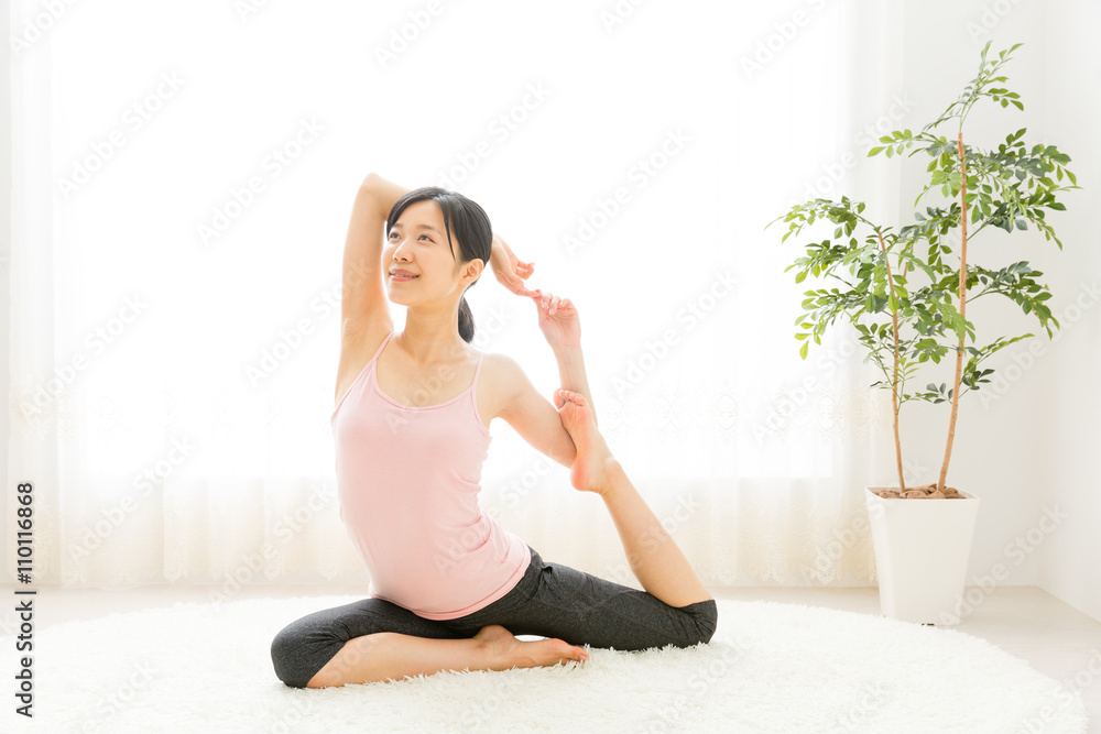 attractive asian woman exercising in the room